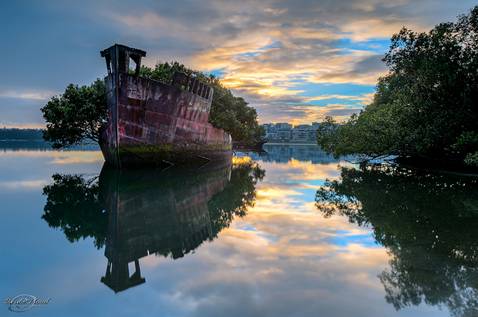 http://twistedsifter.com/2013/04/ss-ayrfield-shipwreck-homebush-bay-sydney-australia/