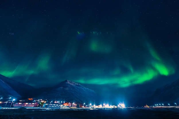 Slide 7 of 31: This Norwegian archipelago in the Arctic Ocean has at least as many polar bears as people and is home to the Global Seed Vault, meant to help restore the world's crops in case of widespread disaster. The town of Longyearbyen, the world's northernmost permanently inhabited community, gets 24 hours of sun in the summer, but 24 hours of darkness in the winter. Related: Best Vacation Rentals for Seeing the Northern Lights