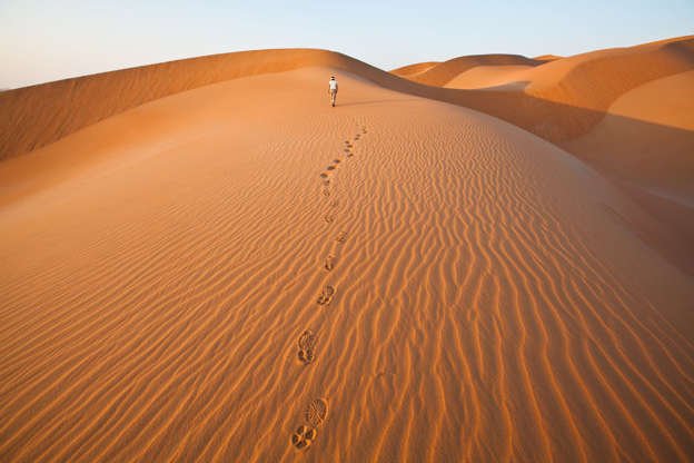 Slide 14 of 31: Dunes as far as the eye can see make up the Rub' al Khali, otherwise known as The Empty Quarter, which stretches over a third of the Arabian Peninsula, including vast swaths of Saudi Arabia, Oman, Yemen, and the United Arab Emirates. Many of its 250,000 square miles remain unexplored, and it's the largest area of continuous sand in the world.